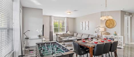 Spacious living room with foosball table