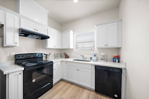 Whip up delicious meals in this charming kitchen