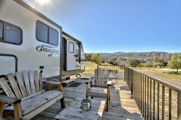 Unwind on your private deck and soak in the breathtaking views that surround you. It's a tranquil oasis where you can relax, reflect, and revel in the beauty of nature, creating cherished memories against a backdrop of stunning vistas