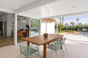 Outdoor dining area under a covered patio to stay cool in the Palm Springs heat.