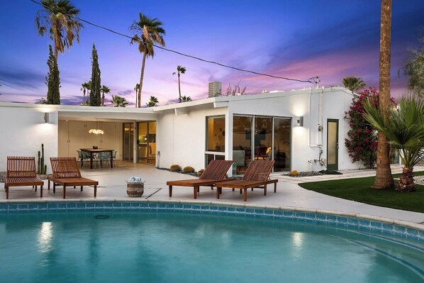 Pool with plenty of lounge chairs for hanging out with family and friends.