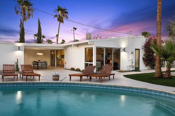 Pool with plenty of lounge chairs for hanging out with family and friends.
