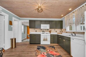 Kitchen. To the left is one bedroom and the bathroom.