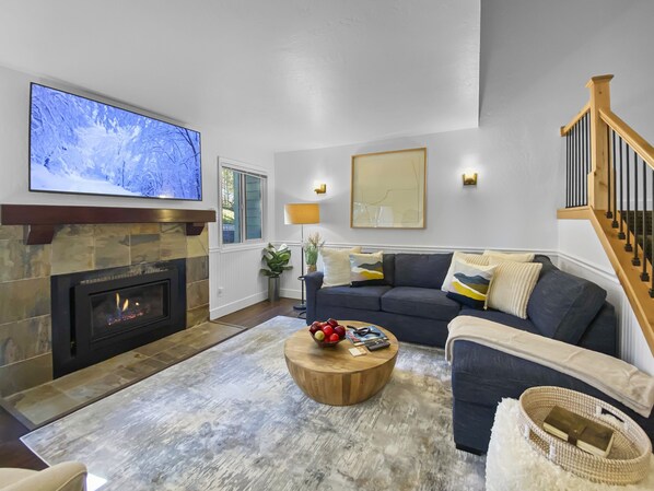 Cozy Living Room with Fireplace and Big Screen TV
