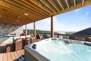 Enjoy the expansive decks year round with hot tub, propane fireplace,