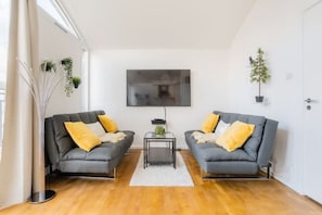 Living Room, with two sofas/sofabeds and a large Flat TV
