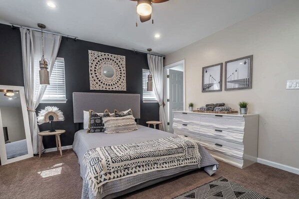 Front bedroom with queen bed, full size fold out futon, full length mirror, and its own bathroom