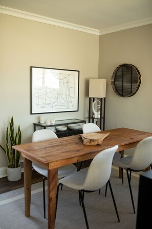 Dining room with french doors leading onto a private patio with fenced yard.