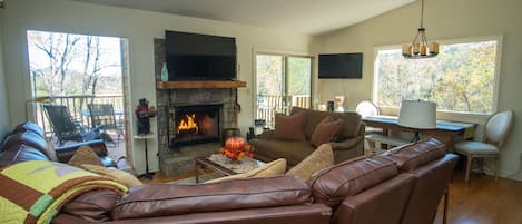 Large open windows bring the outside in giving a treehouse feel.