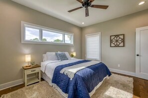 Bedroom 2 on second floor with queen bed and full bathroom attached