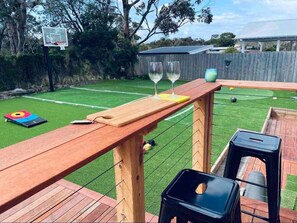 The spacious fenced games backyard is perfect for the kids to run around, shoot some hoops or play a game of mini golf, while adults relax on the spacious deck.