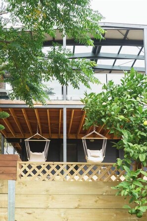 Enjoy lazy days in the hanging chairs on the undercover deck overlooking the quiet backyard.