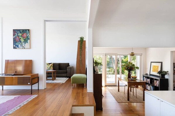 The cosy retreat features a fresh, white palette, timber accents and Scandi-inspired furnishings.  
