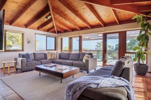 The light-filled living area offers a generous corner lounge and sofa where guests can settle in with a movie. 
