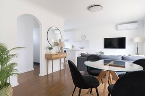 The open-plan dining area includes a four-seater table to share meals at home. 
