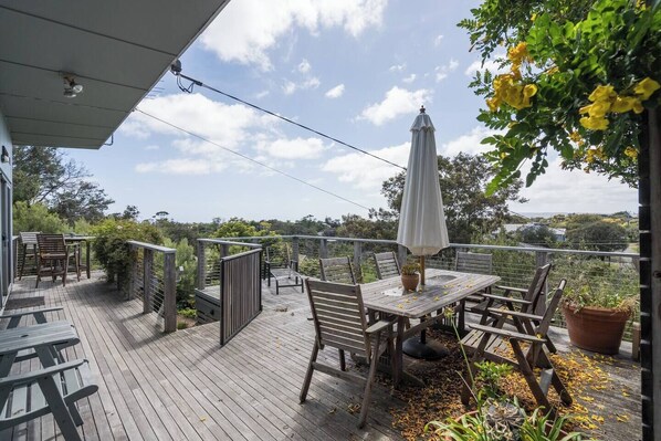 A six-seater table and shade umbrella on the front deck provide a laidback setting to enjoy alfresco meals while soaking up the sea breezes and sweeping views overlooking Rye. 
