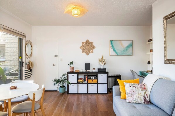 Guests can kick back on the sofa in the open-plan living area with an HDTV after a day of sightseeing. 