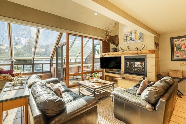 Main Level Living Room with Gas Fireplace and 50" Smart TV