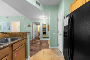 Fully stocked kitchen. Bunk room entry