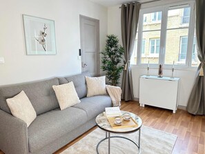 Entertain guests in the inviting living room with a flat-screen TV