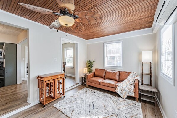 Secondary living room with ceiling fan and plush seating. Perfect for reading a book!