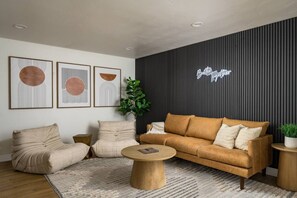 Throw on a record or plug in your own tunes in this stylish + comfy living room.