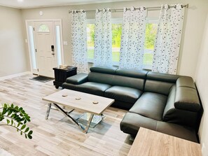 The living room welcomes you. Perfect place for quiet reading or simply relaxing