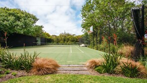 Full size tennis court, basketball net available.
