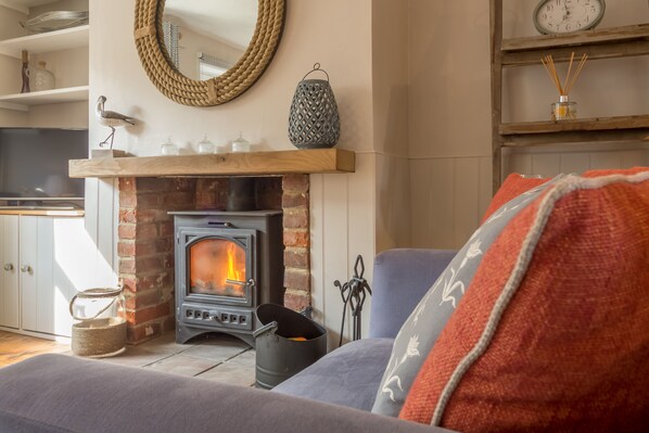 Burnham Cottage, Wells-next-the-Sea: Nautical sitting room with wood burning stove