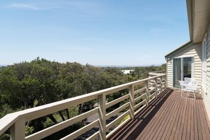 The wraparound front balcony comes with a seating area to feel fully immersed in nature.
