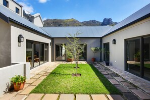 Private garden between office and guest suite.