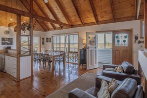The kitchen and dining area is open plan, flowing to the front deck.