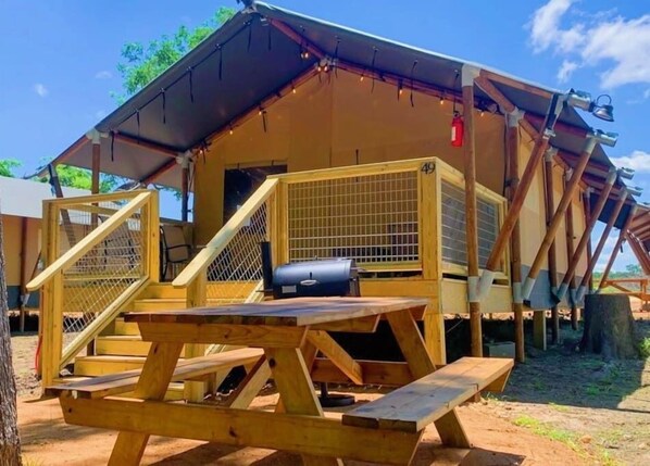 Each Safari Cabin has it's own picnic table, BBQ pit fire pit & hammock.