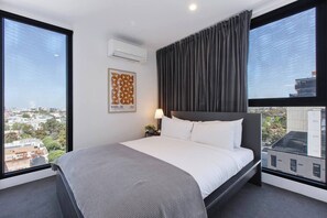 Recharge in the spacious and well-lit primary bedroom, which includes a sleek ensuite for added convenience.