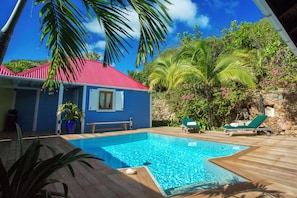 Terrace around the pool, deckchairs, parasol, barbecue, beautiful pool.