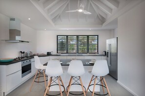 Fully equipped. Gas stove, oven, fridge, freezer with ice maker, fan, microwave, mixer, dishwasher, Nespresso coffee machine. Breakfast bar with 4 high chairs. Interior dining table for eight people. Outdoor dining table on the terrace. Ocean view. 