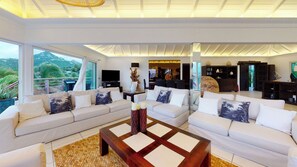 Located on the upper level. Air conditioning, ceiling fans, HD-TV, Dish Network, DVD player, telephone, iPod docking station, WIFI, safe with key. Fully equipped, breakfast bar with four black stools, fridge and freezer with ice maker, hood, gas cooker an