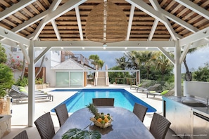 Indoor dining area next to the living room with the table for 8 guests. Outdoor dining table next to the pool.