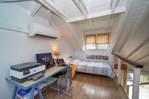 On the upper level. Air conditioning, 2 single beds that can be used as an extra bedroom, with an extra fee of 50$/night.