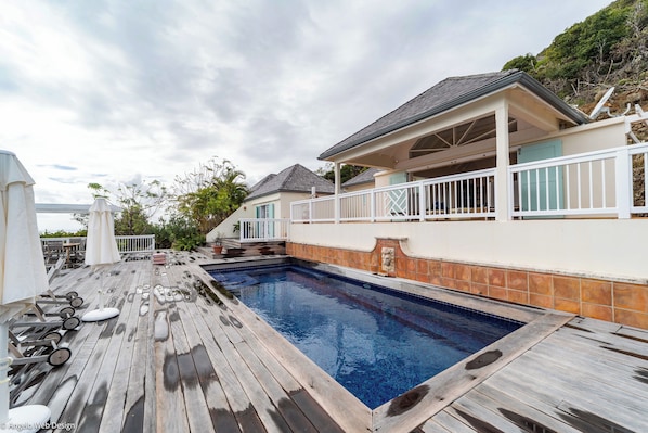 Lovely pool with steps, expansive terrace, sun loungers, outdoor dining table for 6 people.