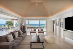 Interior living-room with ceiling fans, HD-TV with Dish Network, DVD player, surround sound system (also near the pool and outside), telephone.