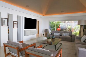 Interior living-room with ceiling fans, HD-TV with Dish Network, DVD player, surround sound system (also near the pool and outside), telephone.