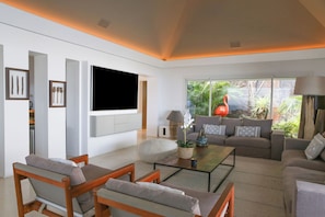 Interior living-room with ceiling fans, HD-TV with Dish Network, DVD player, surround sound system (also near the pool and outside), telephone.