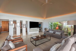 Interior living-room with ceiling fans, HD-TV with Dish Network, DVD player, surround sound system (also near the pool and outside), telephone.