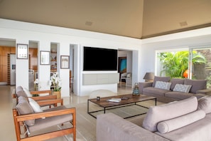 Interior living-room with ceiling fans, HD-TV with Dish Network, DVD player, surround sound system (also near the pool and outside), telephone.