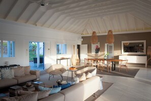 Living room opening entirely onto the pool terrace, air conditioning, ceiling fans, HD-TV, Dish Network, Apple TV, Sonos Bluetooth speaker, telephone, WIFI. 