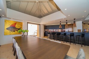 Fully equipped. Electric oven, gas stove, microwave, refrigerator, mixer, centrifuge, freezer, dishwasher, Nespresso machine, blender, kettle, toaster, breakfast bar with stools. Indoor dining area in the great room. Large outdoor dining table on the cove