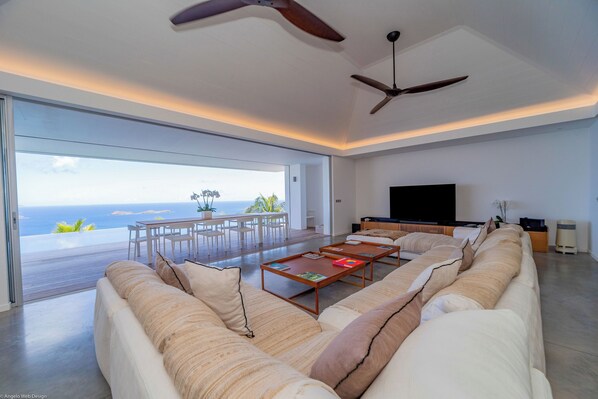 Air conditioning, HD-TV, Dish Network, DVD player, iPod docking station, stereo. The living room opens onto the expansive terrace and the panoramic views.