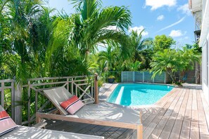 Located on the lower level. A large terrace with deckchairs surround the pool with steps. A heated jacuzzi is located nearby.