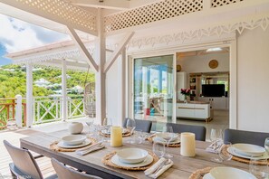 Fully equipped air-conditioned kitchen with electric oven, induction cooker, microwave, fridge and freezer, dishwasher, toaster, coffee maker, blender, electric kettle. Outdoor dining room with a rectangular wooden table for 8 people. Gas barbecue on the